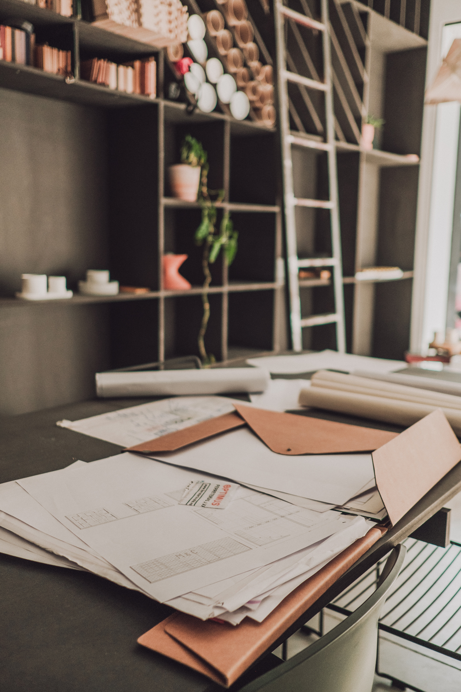 Documents Spread Out on Black Table in Studio